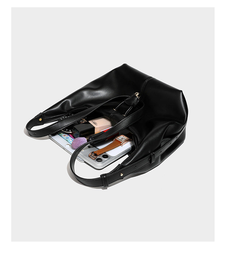 Slouchy hobo bag with smooth leather-look finish, drawstring cinch closure, and gold-tone bead hardware, detail view 16