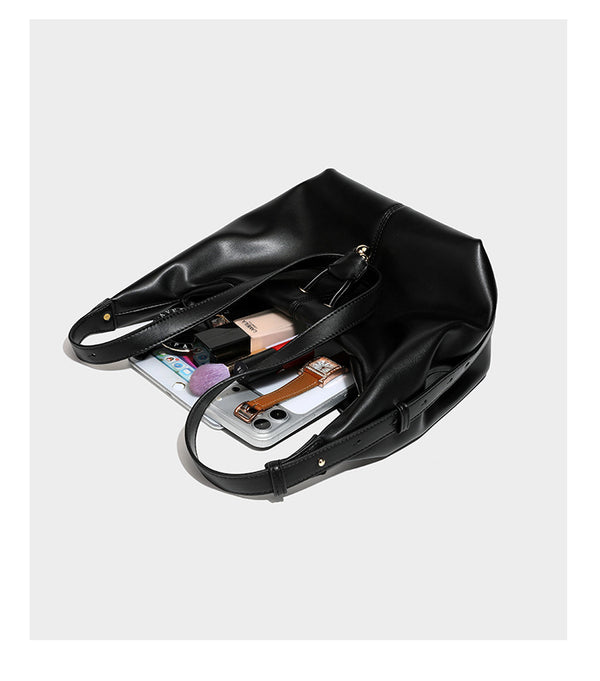 Slouchy hobo bag with smooth leather-look finish, drawstring cinch closure, and gold-tone bead hardware, detail view 16