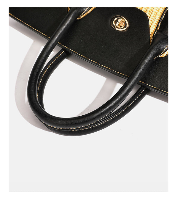 Structured tan woven straw tote bag with black leather-look trim, twin rounded top handles, gold-tone turn-lock front flap