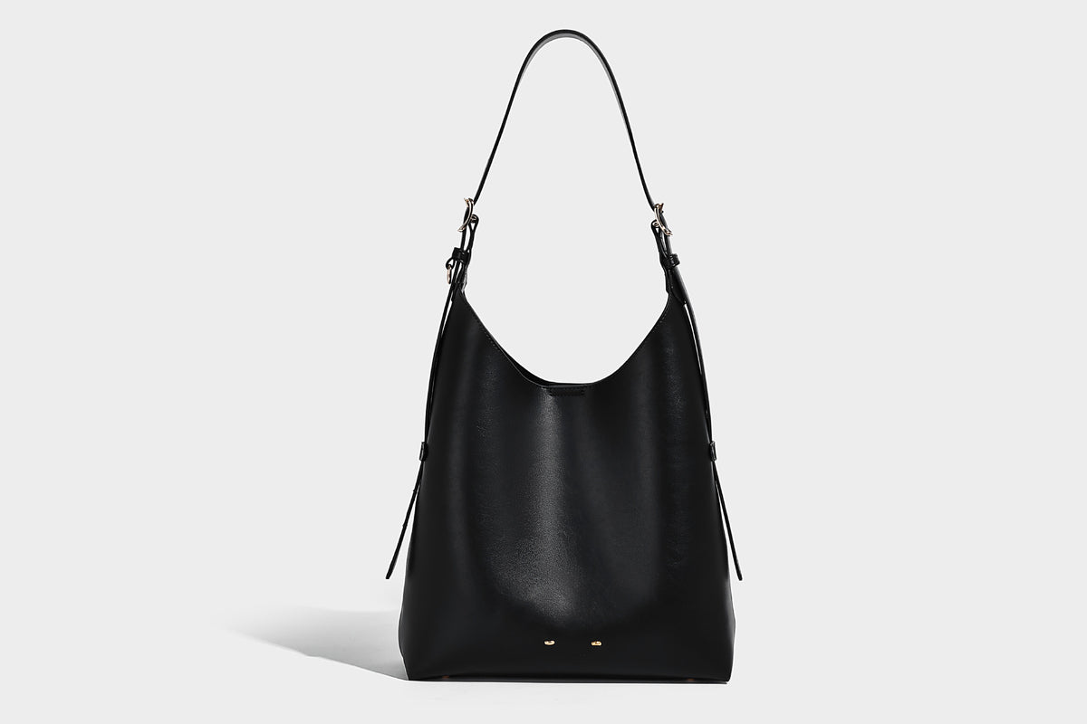 Large open-top hobo shoulder bag in tan leather-look finish with detachable zip pouch and adjustable buckle strap, detail