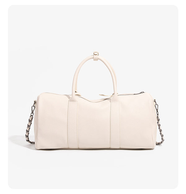 Large cream white pebbled leather-look barrel travel bag with twin top handles, chunky chain shoulder strap, front zip