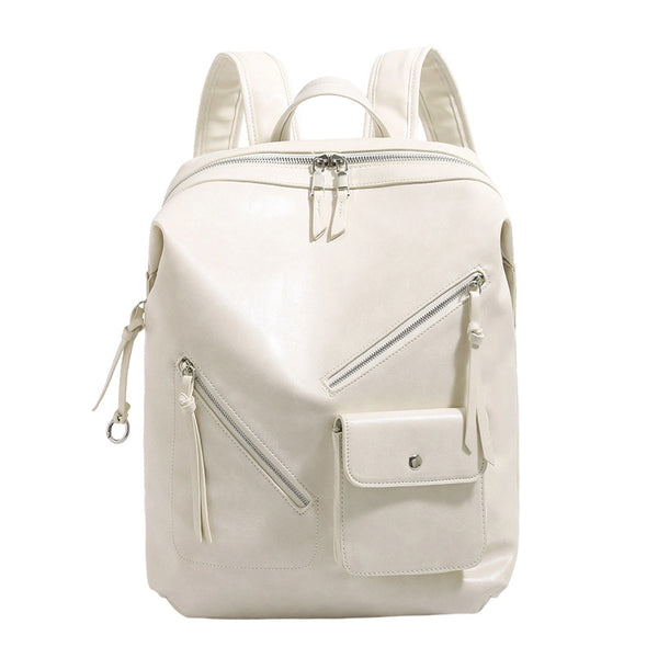 Structured smooth leather-look backpack handbag with dual top zip closure, diagonal front zip pocket, snap-flap mini pocket