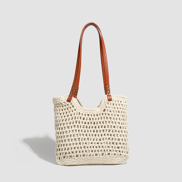 Open-knit woven tote bag with leather-look shoulder straps and brass-tone hardware in off-white, detail view 6