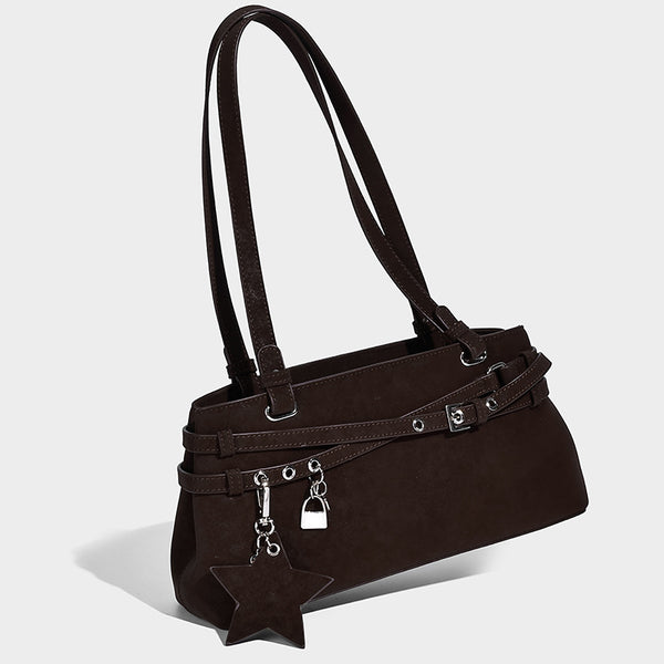 Structured trapezoid shoulder tote in dark brown matte suede-look finish with dual straps, wraparound belt bands