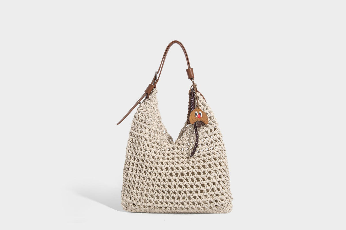 Slouchy open-knit crochet hobo tote bag with leather-look top handle and metal buckle hardware, detail view 13
