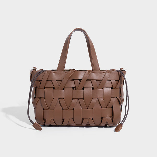Structured woven basket tote handbag with contrasting dark trim, double top handles, detachable shoulder strap, and