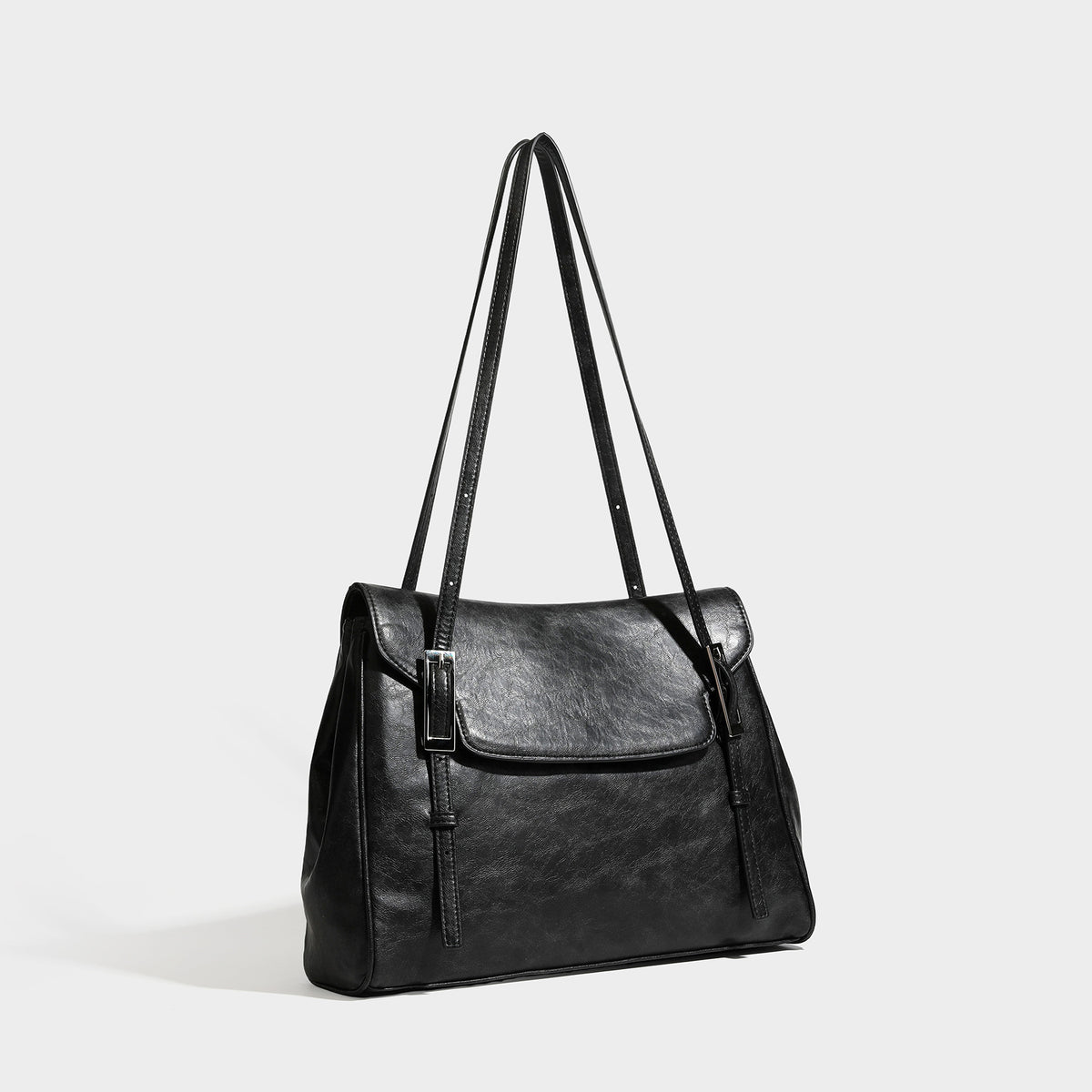 Structured flap-top shoulder tote bag in distressed leather-look finish with silver-tone buckle hardware and double shoulder