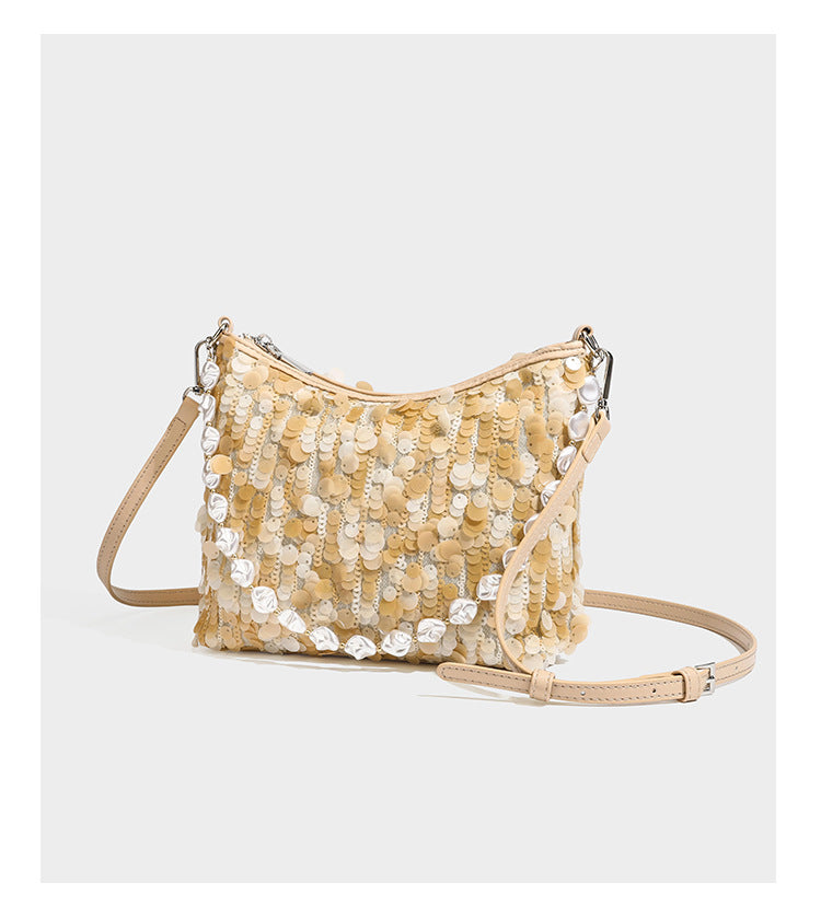 Champagne and ivory large-disc sequin shoulder bag with baroque faux-pearl beaded chain strap and silver-tone zip closure