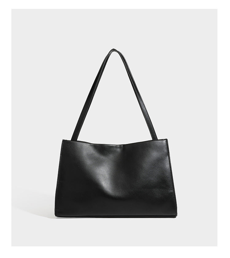 Structured rectangular shoulder tote bag with smooth leather-look finish, long double straps, and gold-tone gourd emblem on