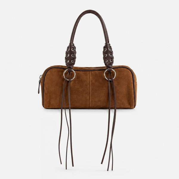 Rectangular suede-look barrel bag with laced eyelet handles, silver O-ring hardware, and hanging leather-look fringe tie