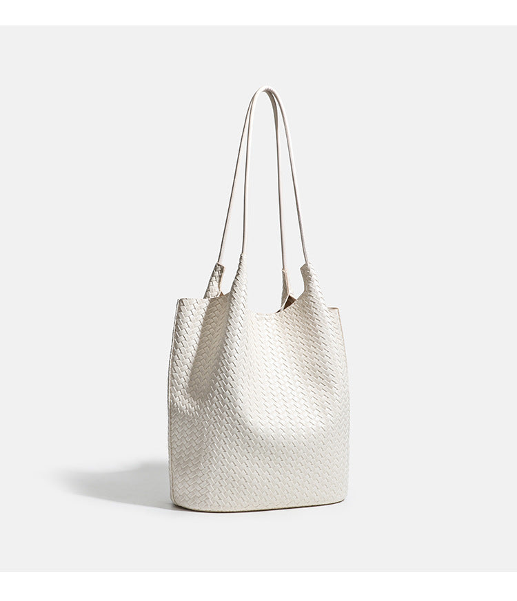 Large woven textured tote bag with long shoulder straps and structured rectangular base, detail view 12