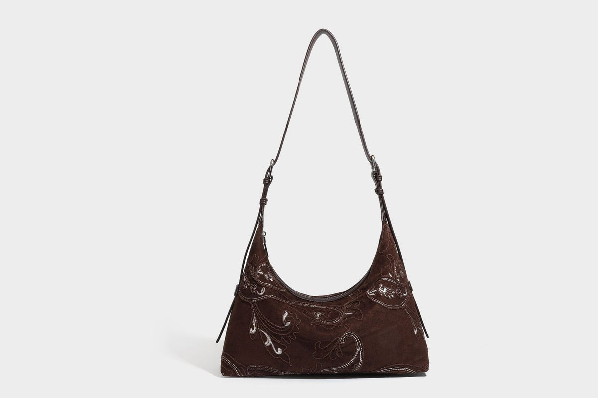 Deep chocolate suede-look hobo shoulder bag with tonal paisley floral embroidery, smooth dark leather-look trim, top zip