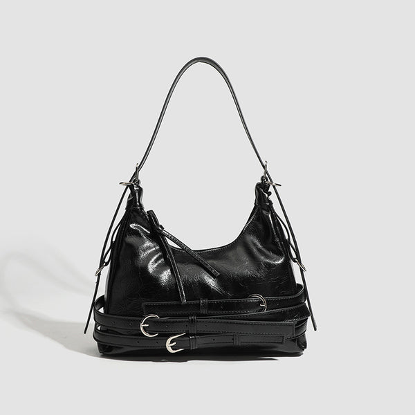 Slouchy hobo shoulder bag in glossy crinkled leather-look finish with silver-tone buckle hardware and slim adjustable strap