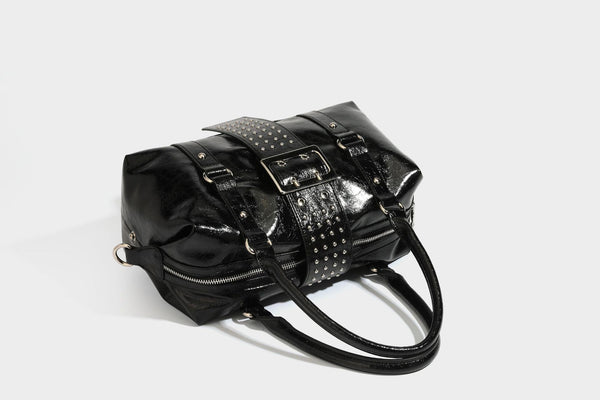 Glossy crinkled barrel handbag with silver stud buckle strap and detachable shoulder strap, detail view 33