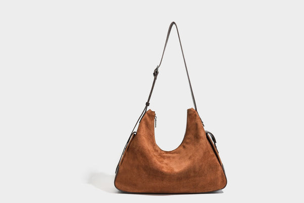 Slouchy cognac brown matte suede-look hobo shoulder bag with dark brown leather-look trim, top zip closure, front flap