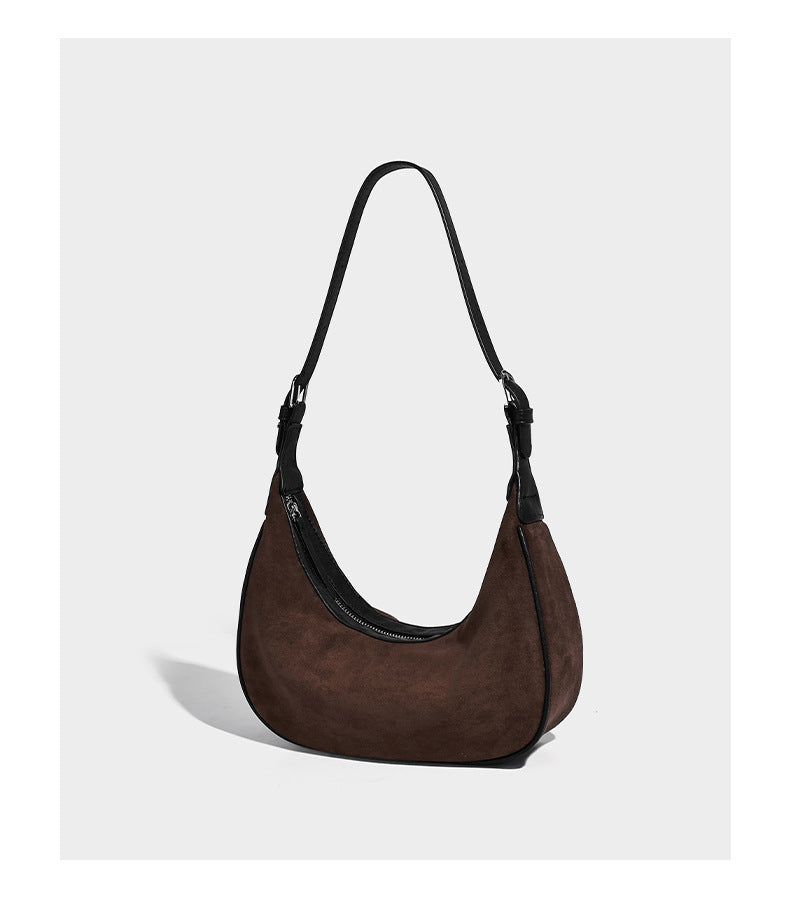 Crescent hobo shoulder bag in matte suede-look finish with black trim and adjustable strap, detail view 11