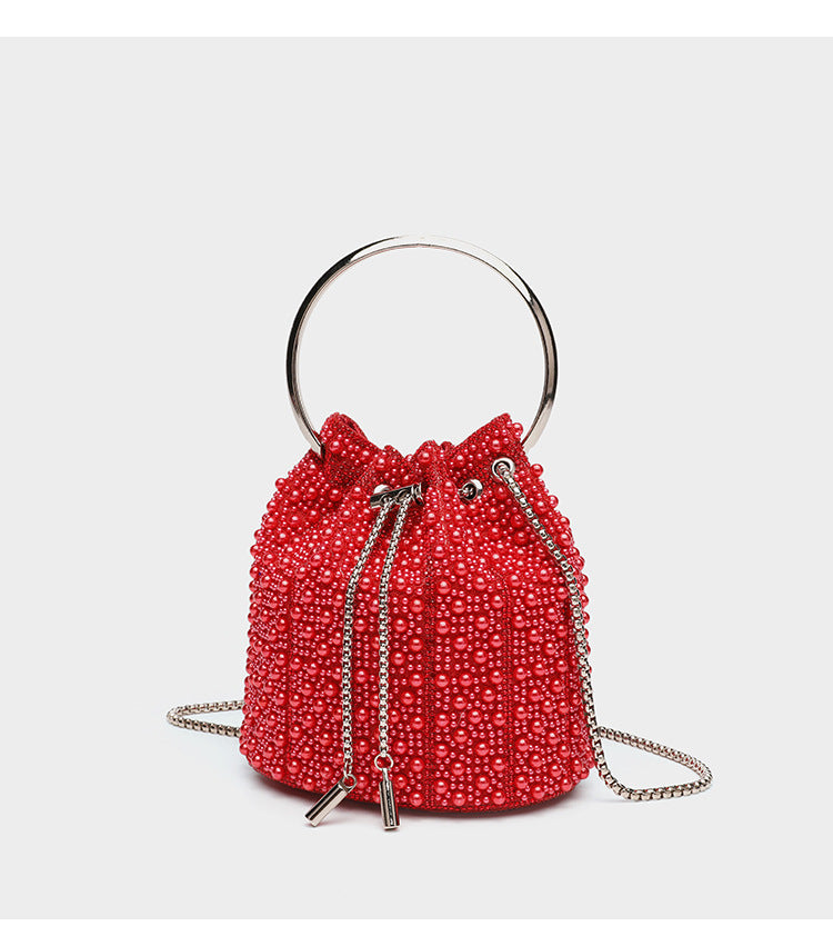 Small pearl-beaded drawstring bucket bag with silver-tone ring top handle and chain shoulder strap, detail view 20