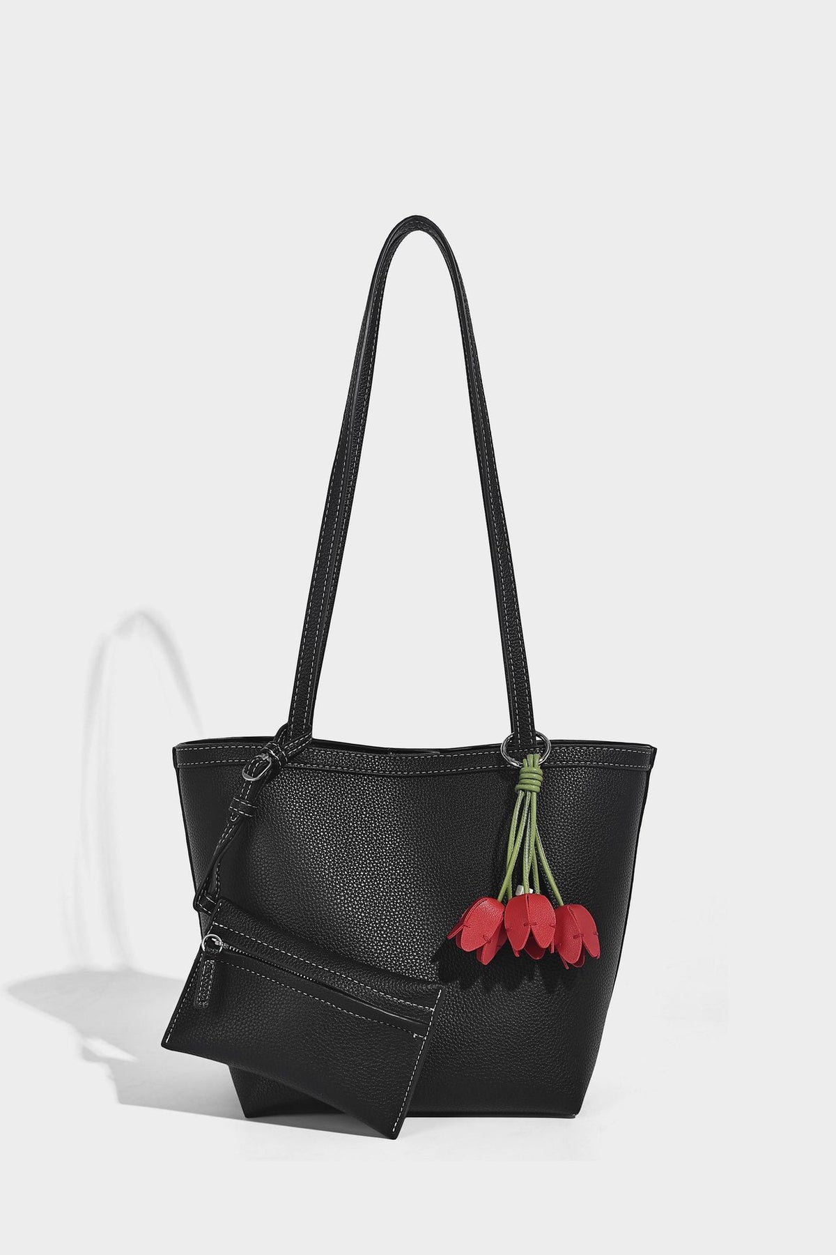 Structured pebbled leather-look tote bag in taupe with long shoulder strap, detachable zip pouch, and pink tulip flower
