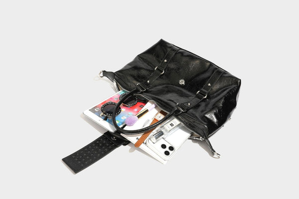 Glossy crinkled barrel handbag with silver stud buckle strap and detachable shoulder strap, detail view 39