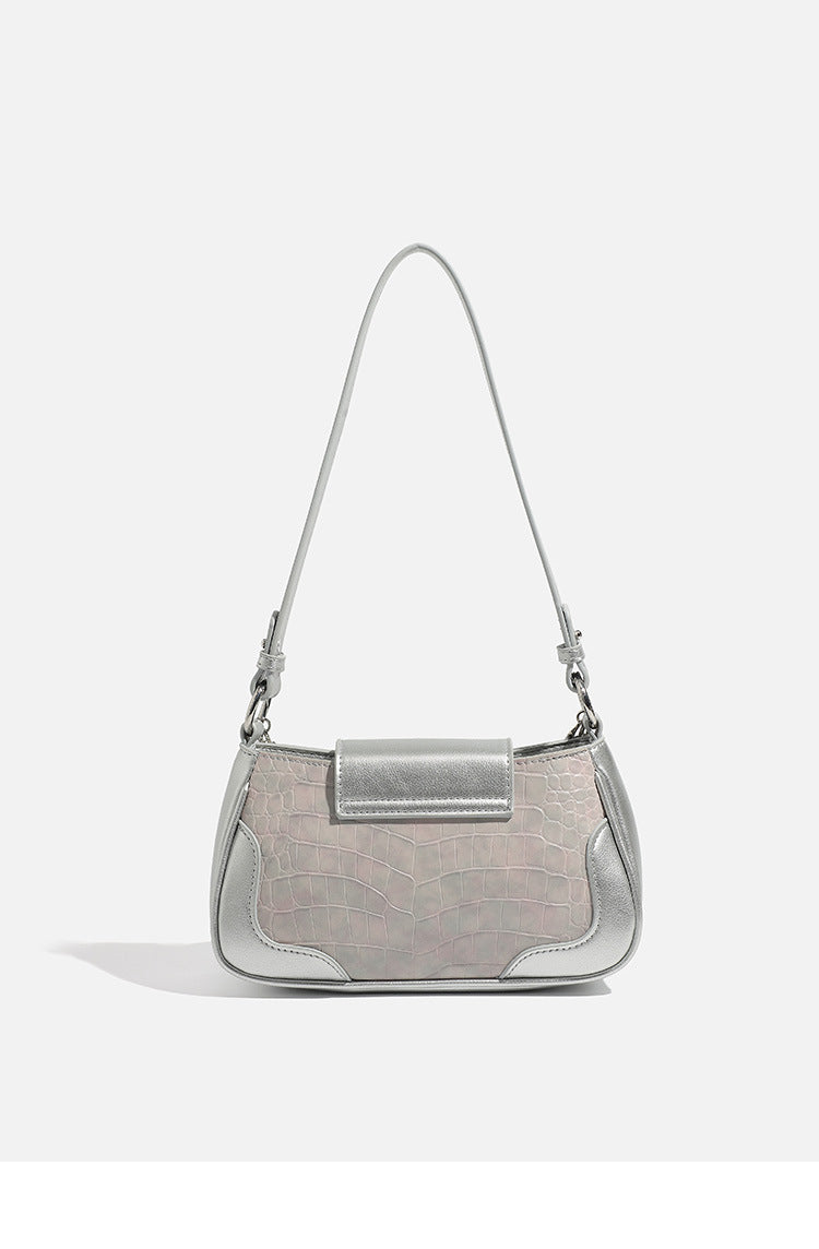 Compact silver flap shoulder bag with pale-pink crocodile-embossed panel, chain bead handle, bow charm, and adjustable