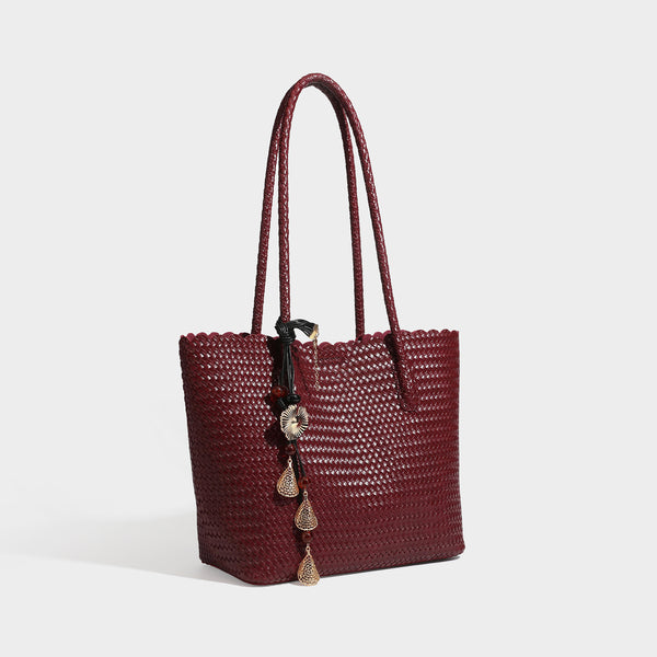 Large open-top woven leather-look tote bag in dark brown with scalloped edge, braided double shoulder straps, and decorative