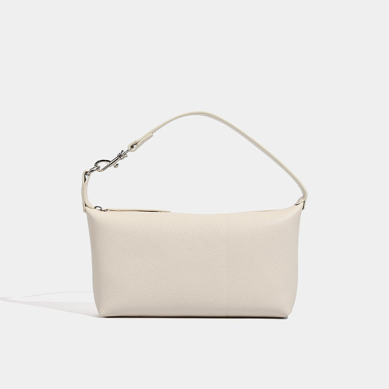 Small pebbled zip-top hobo bag with detachable adjustable strap and silver-tone hardware, detail view 8