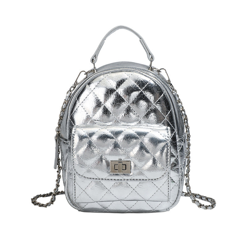 Quilted leather-look backpack purse with chain strap and turn-lock front pocket, detail view 5