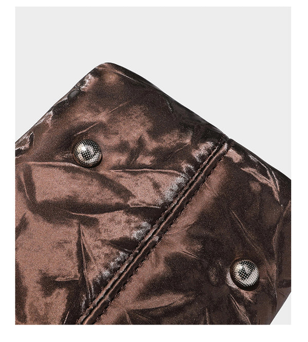 Slouchy hobo shoulder bag in crinkled metallic brown leather-look finish with braided rope knots, silver-tone hardware