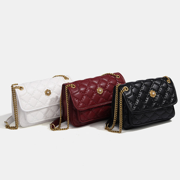 Compact diamond-quilted flap shoulder bag with gold-tone chain strap and floral turn-lock clasp, detail view 2