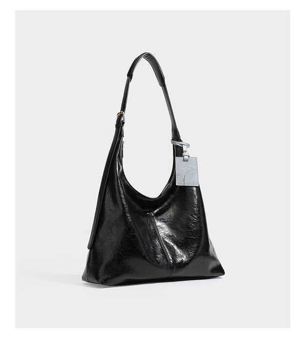 Große dunkelbraune, glänzende, geknautschte Hobo-Schultertasche mit Reißverschluss, goldfarbenen Beschlägen, verstellbarem Riemen und hellblauem