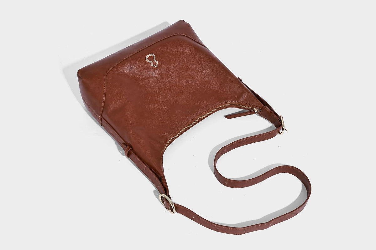 Glossy leather-look slouchy hobo shoulder bag with zip closure, gold-tone hardware, and adjustable strap, detail view 23