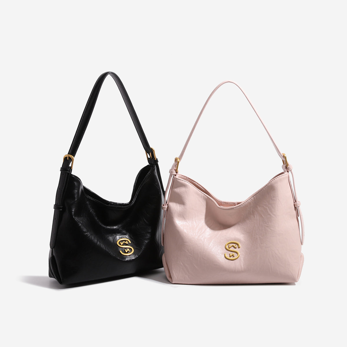 Crinkled leather-look hobo shoulder bag with gold-tone logo emblem and slim adjustable strap, detail view 2