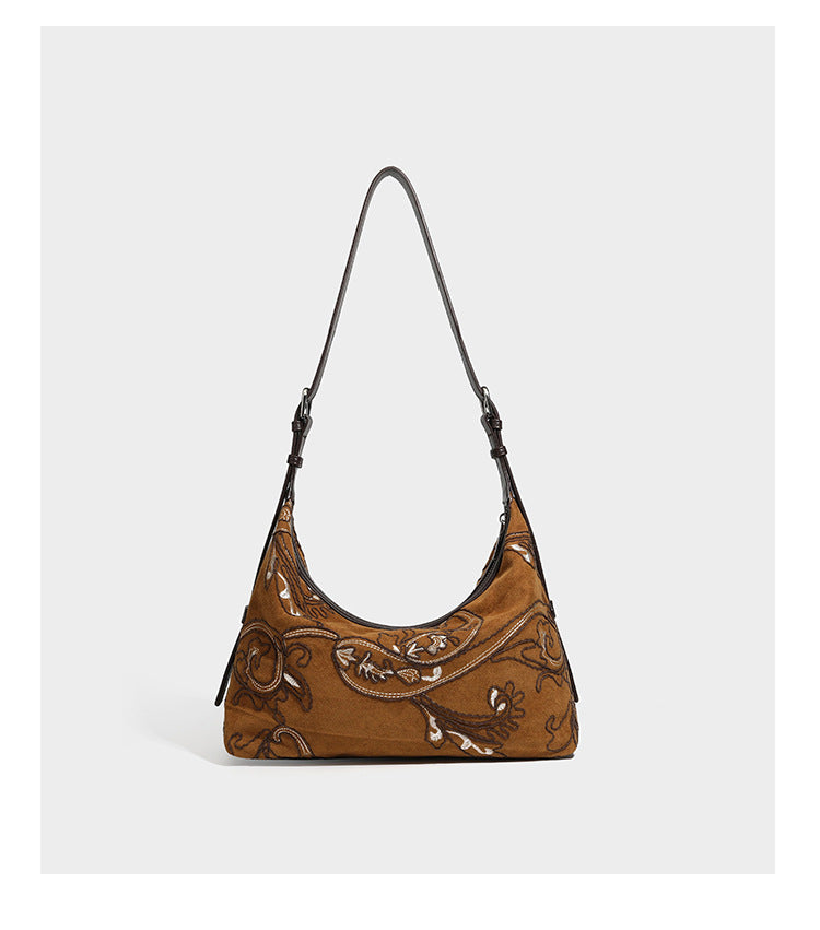 Deep chocolate suede-look hobo shoulder bag with tonal paisley floral embroidery, smooth dark leather-look trim, top zip
