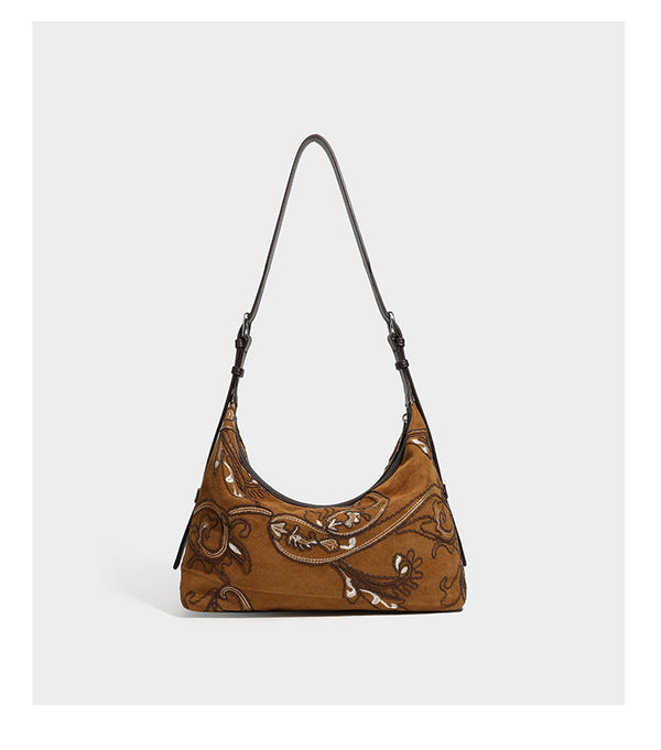 Deep chocolate suede-look hobo shoulder bag with tonal paisley floral embroidery, smooth dark leather-look trim, top zip