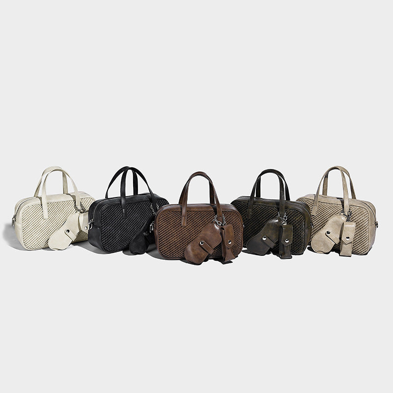 Structured woven-texture front top-handle handbag with zip closure, dual handles, detachable shoulder strap, and matching