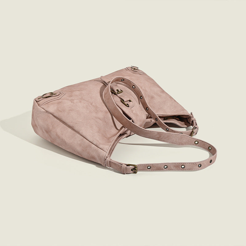 Slouchy distressed leather-look hobo bag with antique brass buckle closure and adjustable shoulder strap, detail view 4