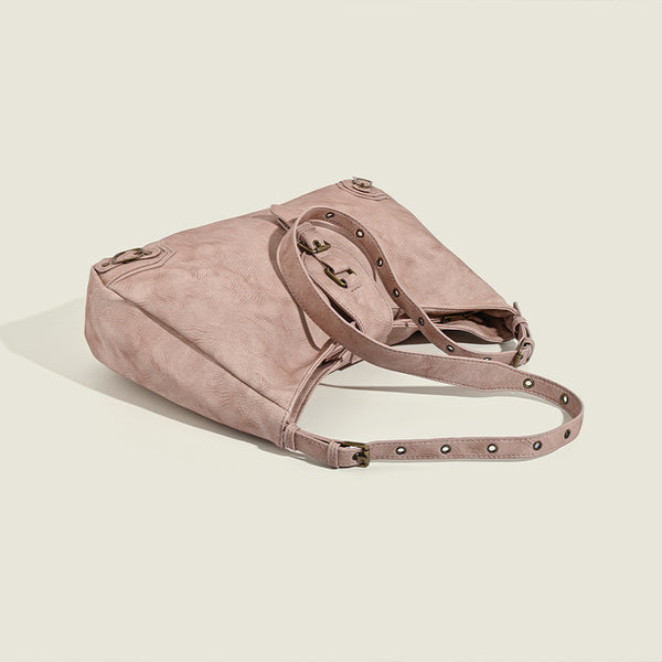 Slouchy distressed leather-look hobo bag with antique brass buckle closure and adjustable shoulder strap, detail view 4