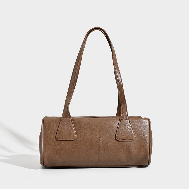Glossy leather-look barrel shoulder bag with zip closure and top handles, detail view 7