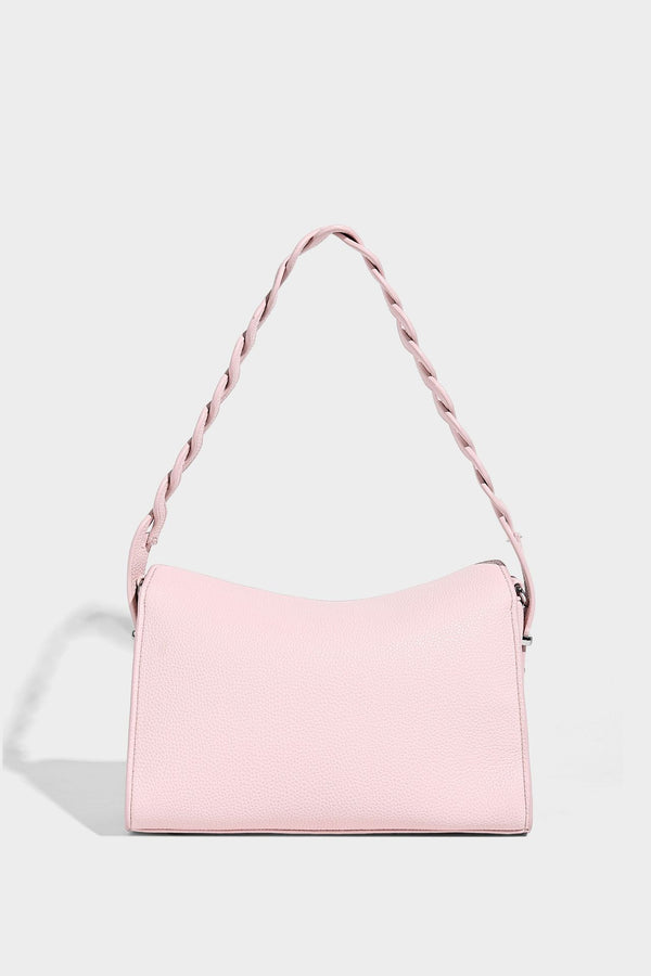 Small structured pebbled-finish shoulder bag with braided top handle, detachable crossbody strap, floral tassel charm, and