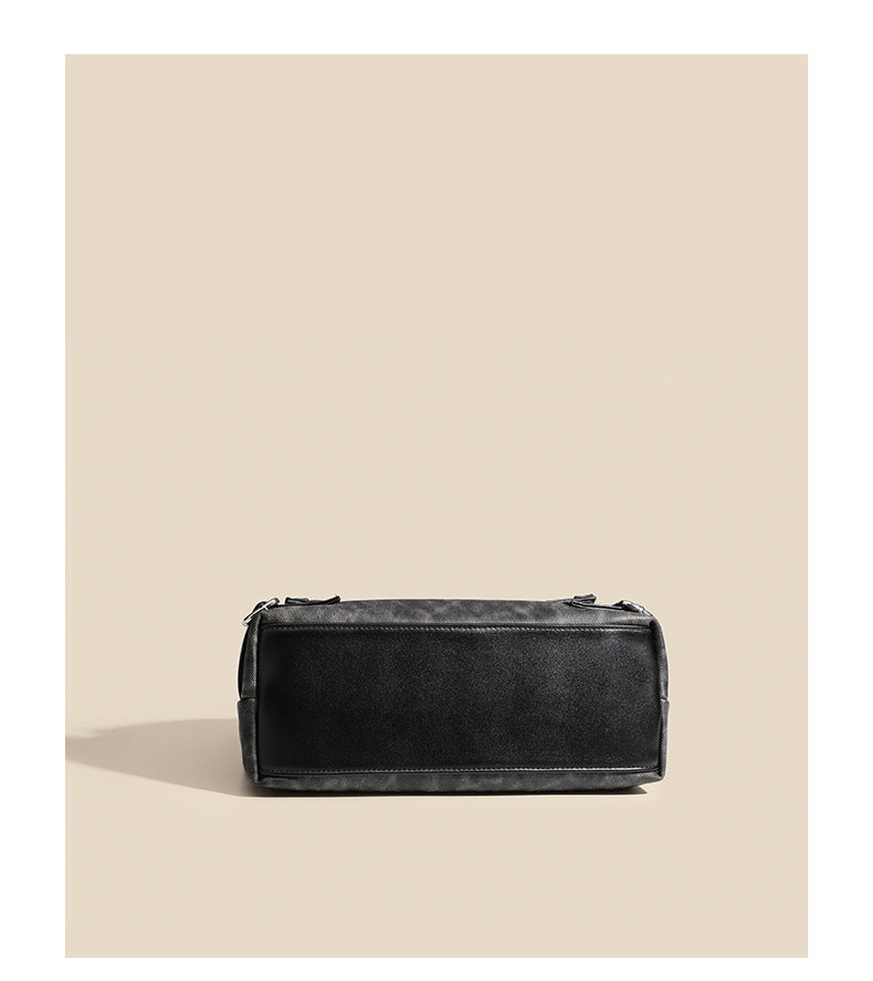 Washed leather-look shoulder tote bag with silver butterfly emblem and buckle hardware, detail view 11