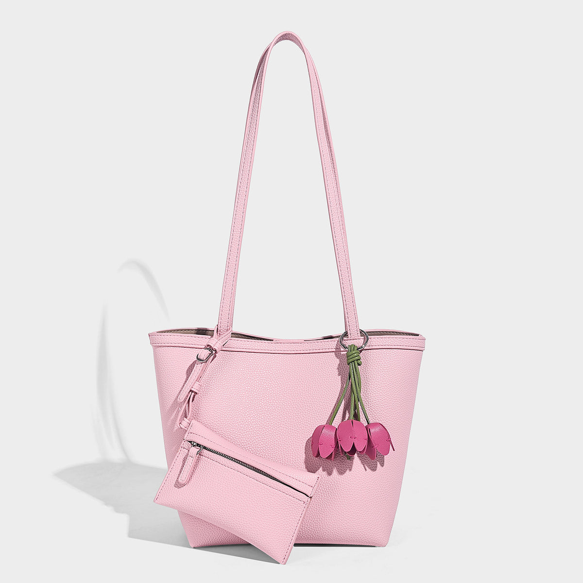 Structured pebbled leather-look tote bag in taupe with long shoulder strap, detachable zip pouch, and pink tulip flower