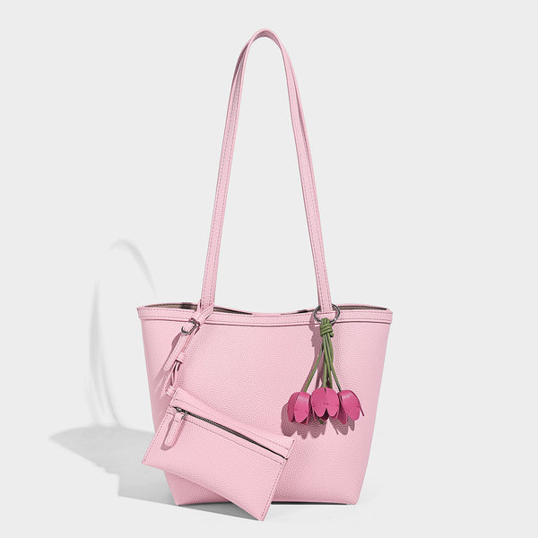 Structured pebbled leather-look tote bag in taupe with long shoulder strap, detachable zip pouch, and pink tulip flower