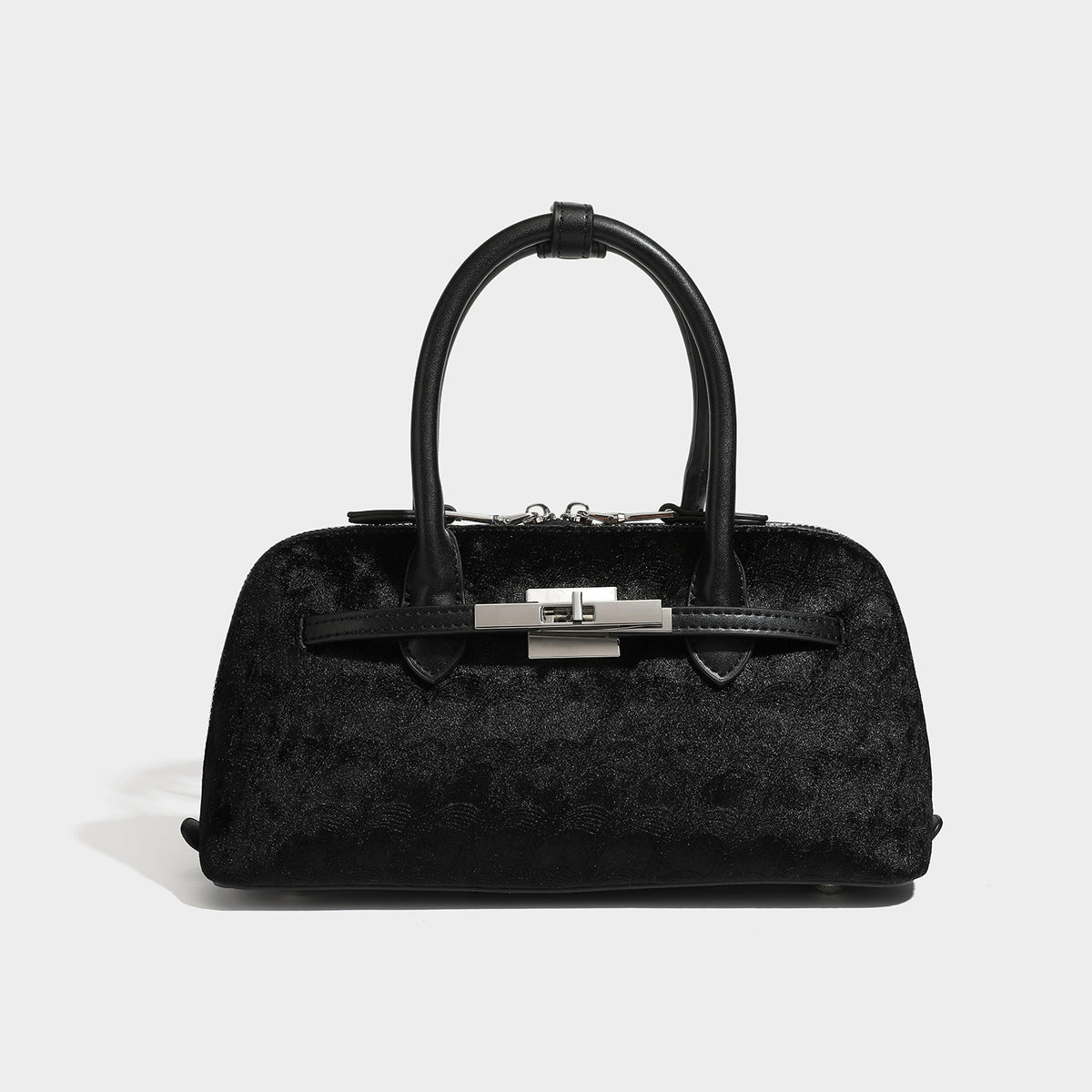Small structured satchel bag in dark brown velvet-like textured finish with leather-look trim, silver-tone turn-lock bar