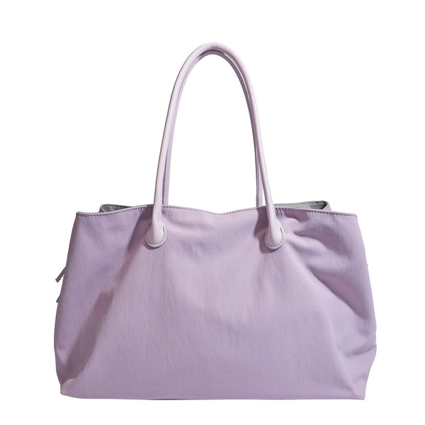 Large soft nylon tote bag with long double handles and zippered top in lavender, detail view 5