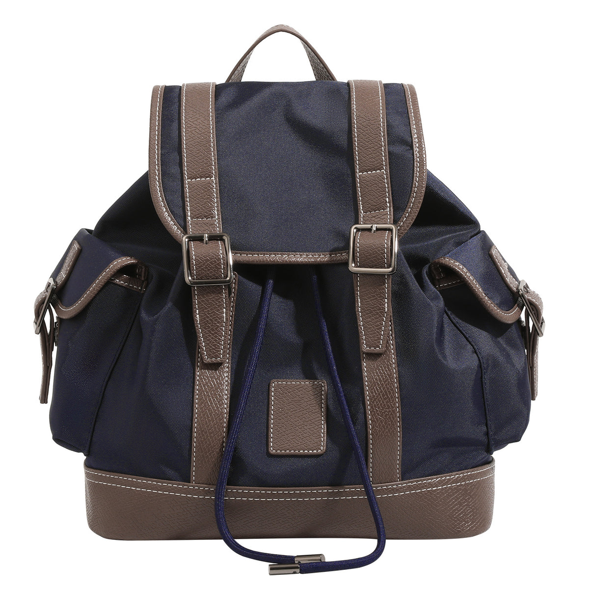 Deep navy canvas backpack with brown textured leather-look trim, drawstring flap closure, buckle-strap front detail, and