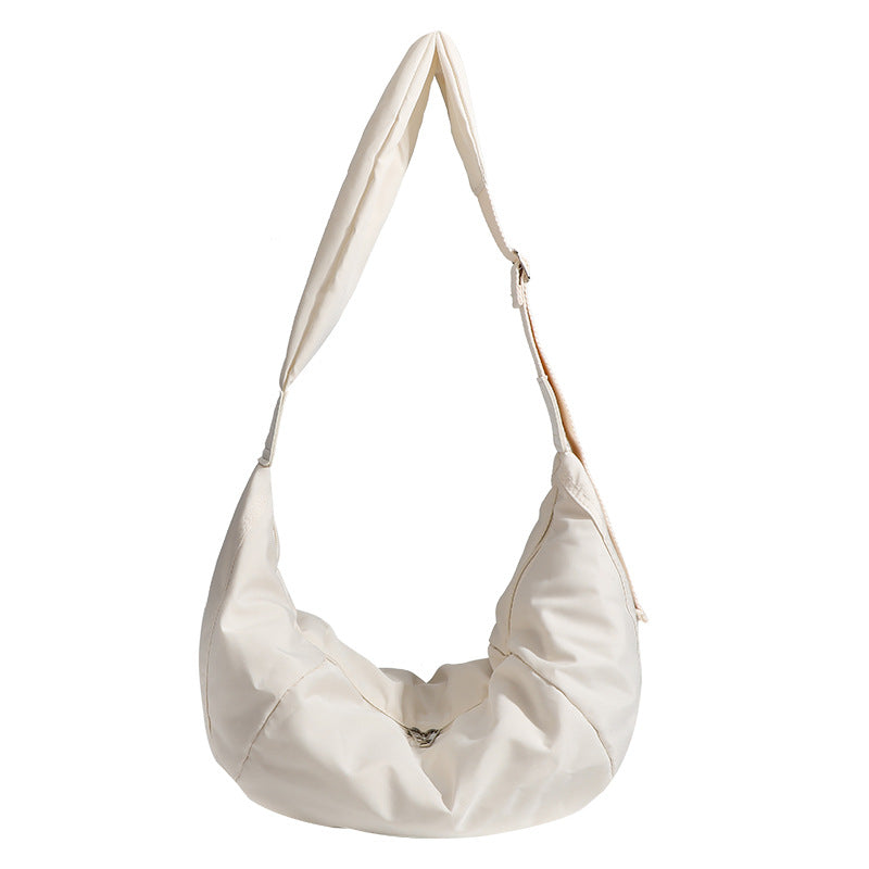 Large crescent sling shoulder bag in gathered fabric with zip closure and adjustable strap, detail view 5