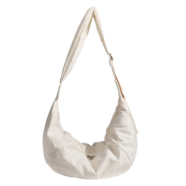 Large crescent sling shoulder bag in gathered fabric with zip closure and adjustable strap, detail view 5