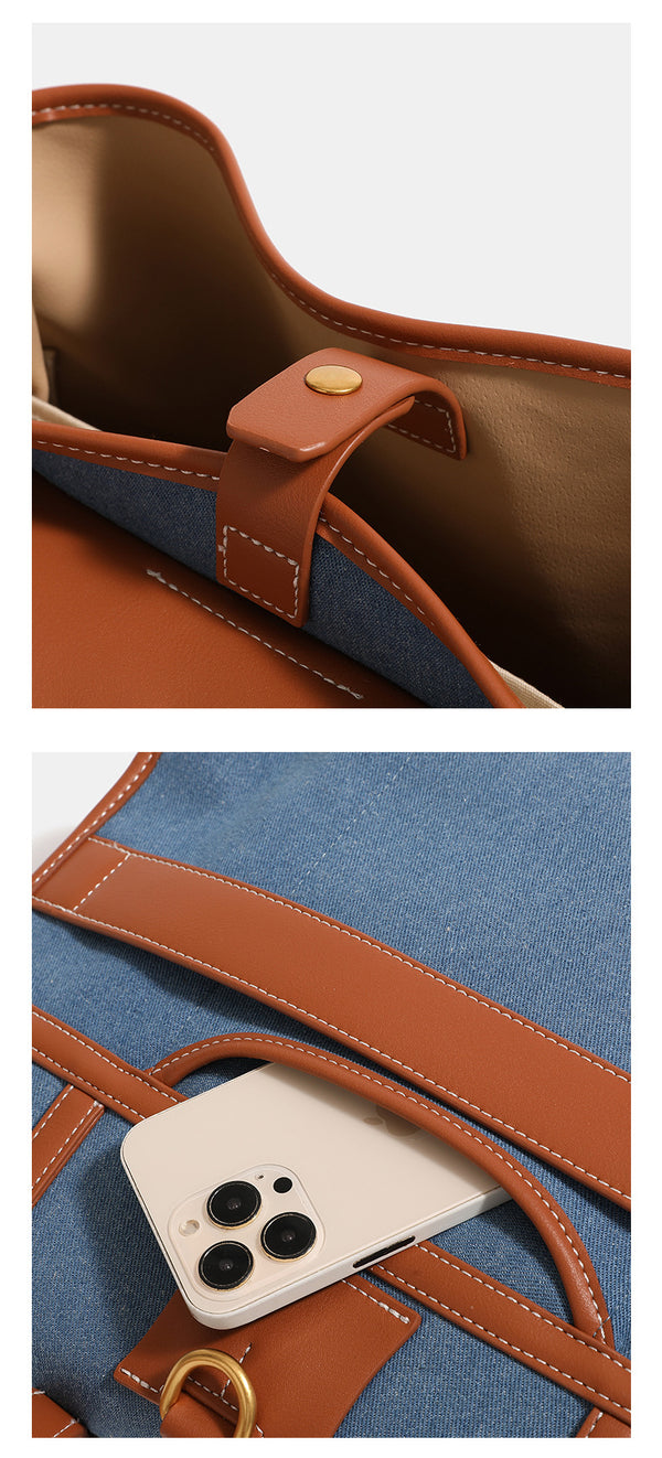 Formstabile, wandelbare Rucksack-Handtasche in Denim-Optik mit cognacbrauner Kunstlederoptik, goldfarbenen Schnallendetails und oberem Tragegriff
