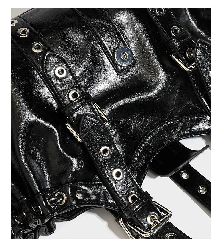 Large black glossy leather-look tote bag with silver buckle straps, eyelet grommet panels, drawstring side gathers, and
