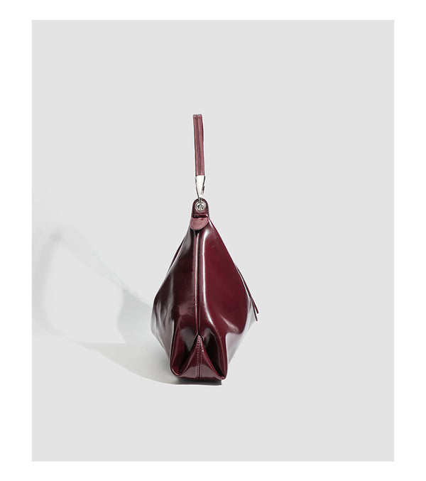 Glossy structured shoulder tote bag with silver-tone hardware and top zip closure, detail view 9